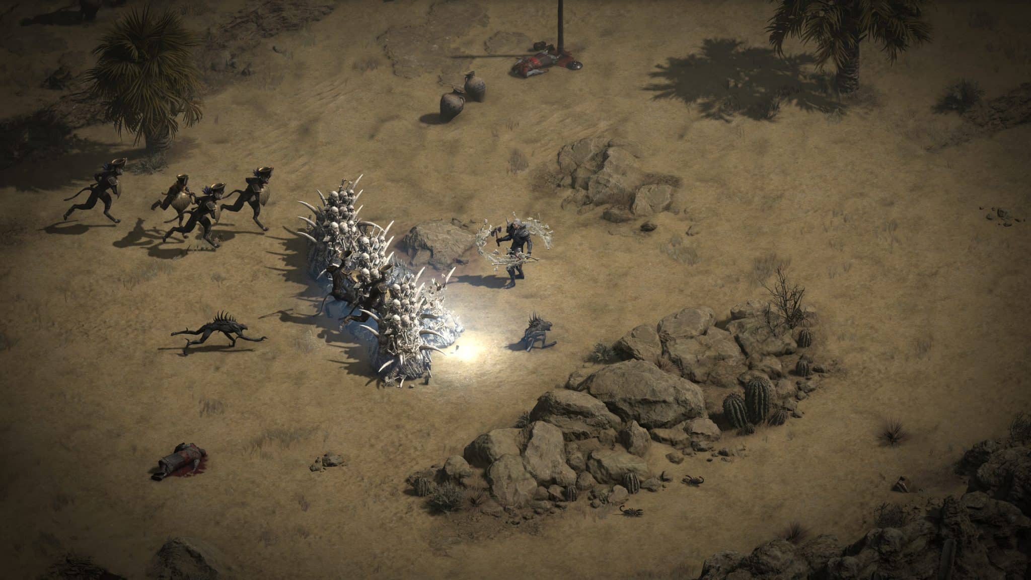 Diablo 2 Resurrected necromancer fights enemies with skeleton army in desert