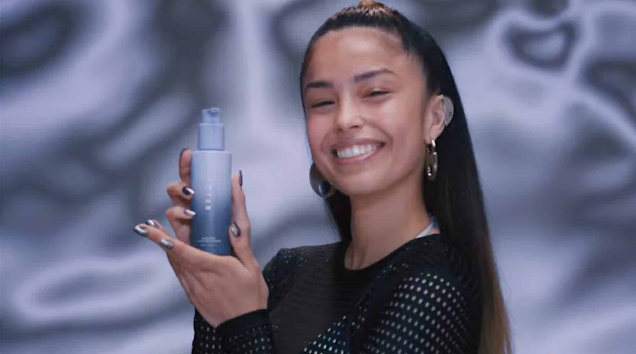 Valkyrae posing with RFLCT products