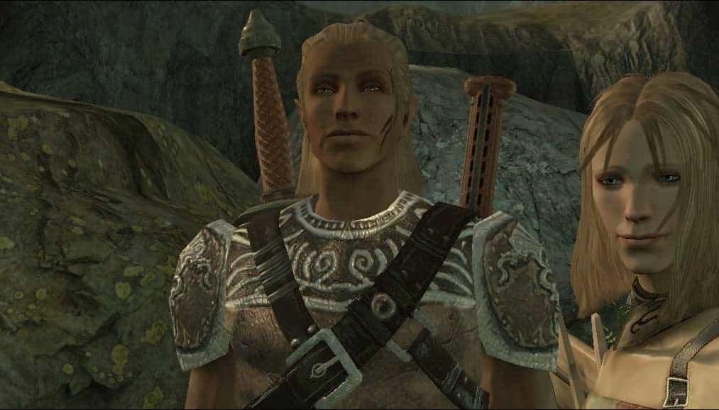 Dragon Age Origins elf man with two daggers looks at camera