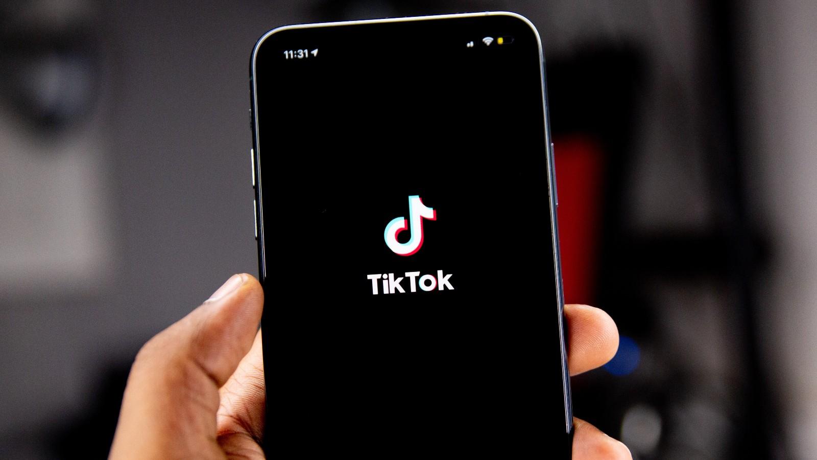 TikTok logo on a black screen