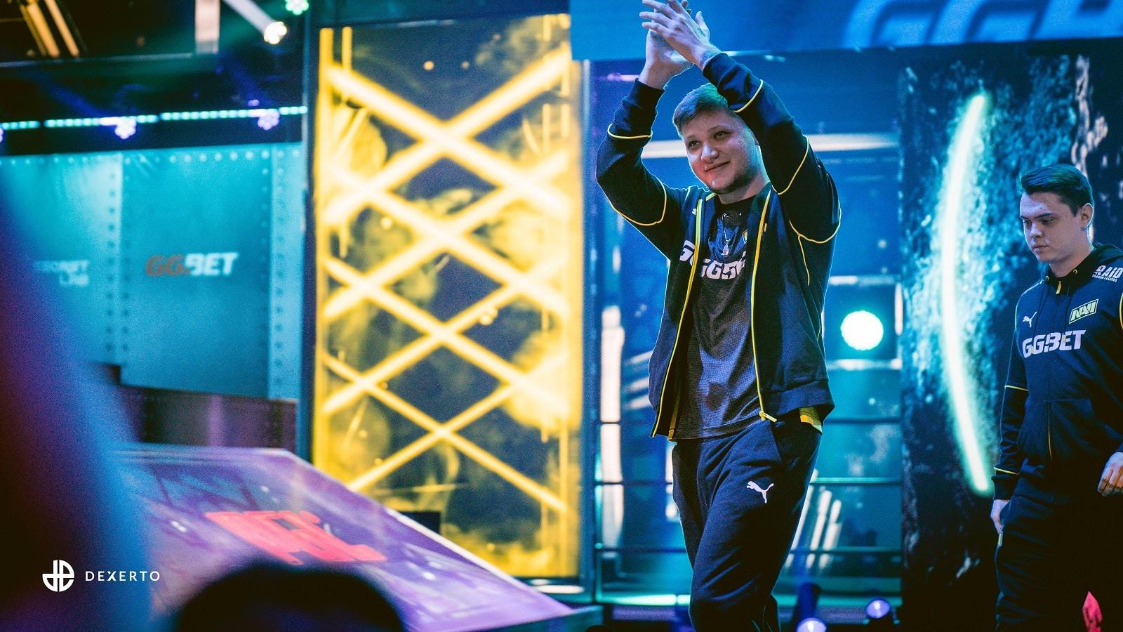 s1mple raising his hands and clapping