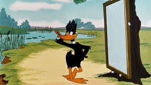 daffy duck posing in front of a mirror