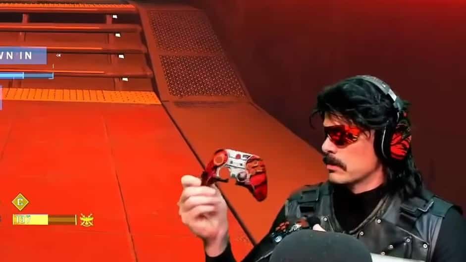 Dr Disrespect holds his shattered controller.