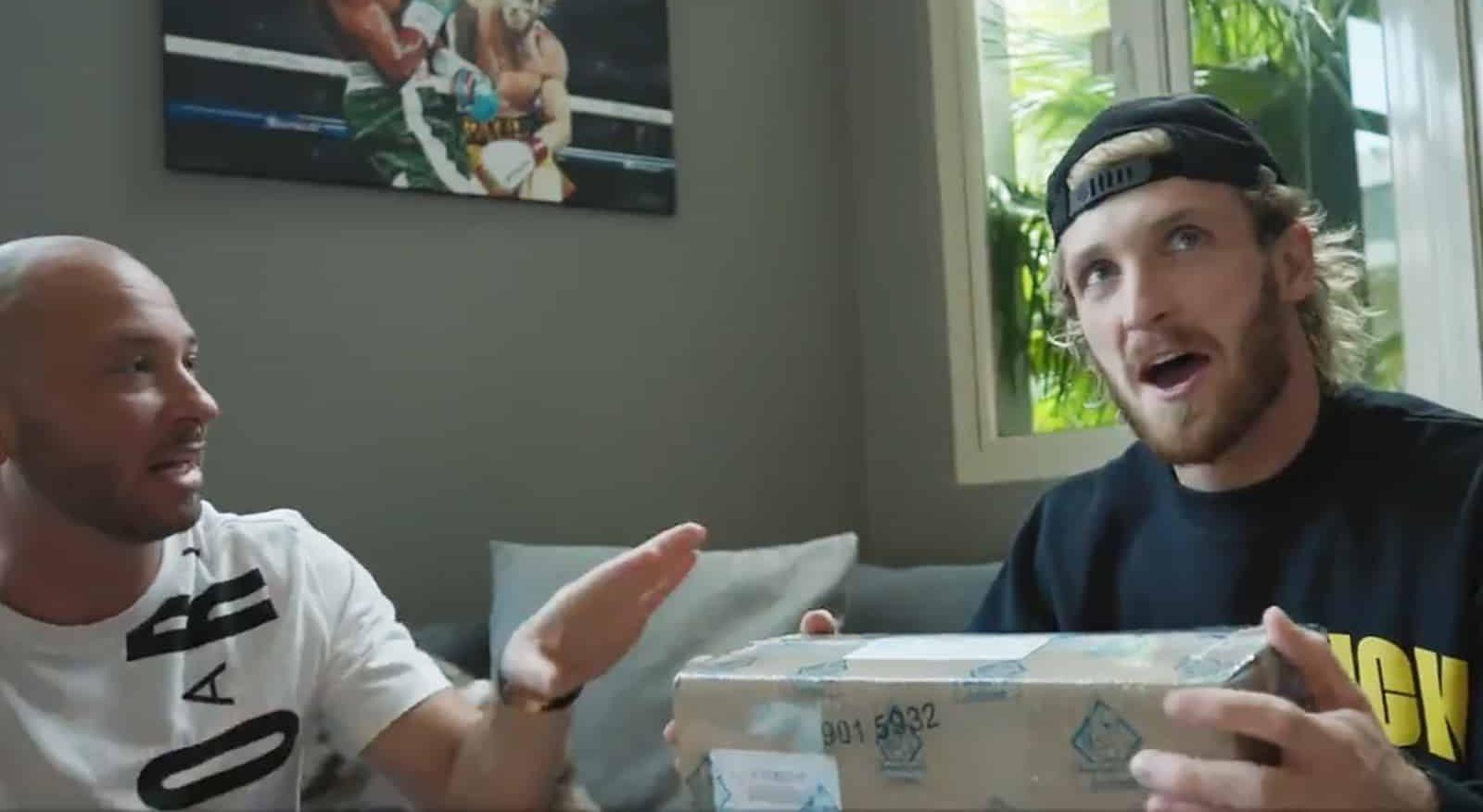 YouTuber Logan Paul holding Pokemon Card box he paid 3.5 million for