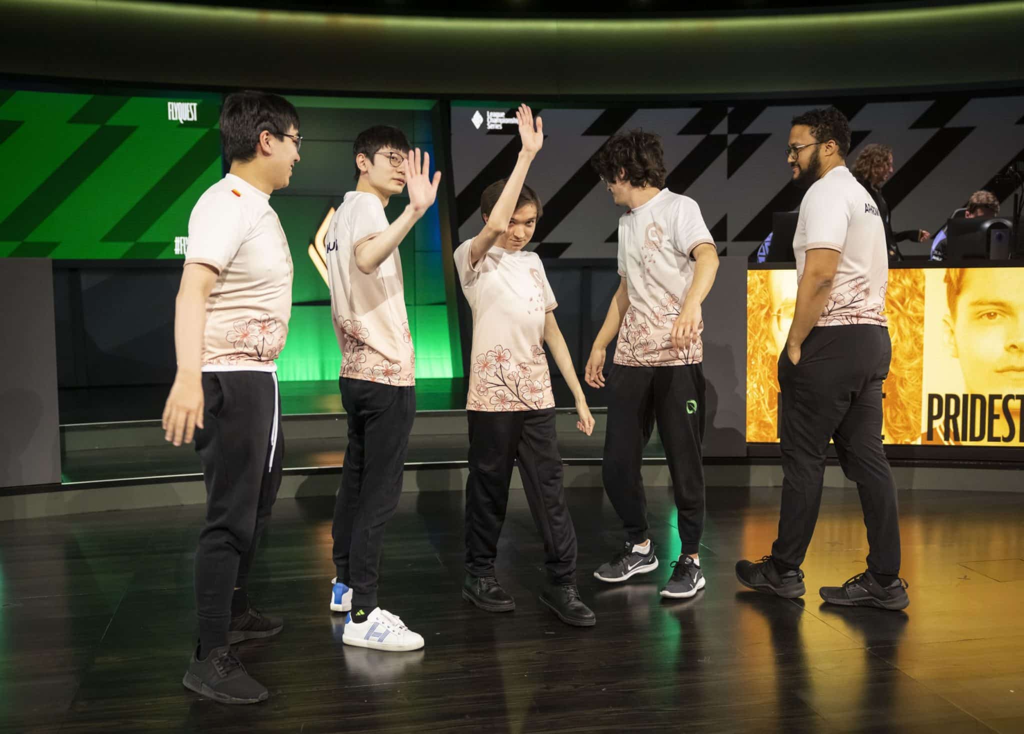 FlyQuest celebrating on stage after LCS win