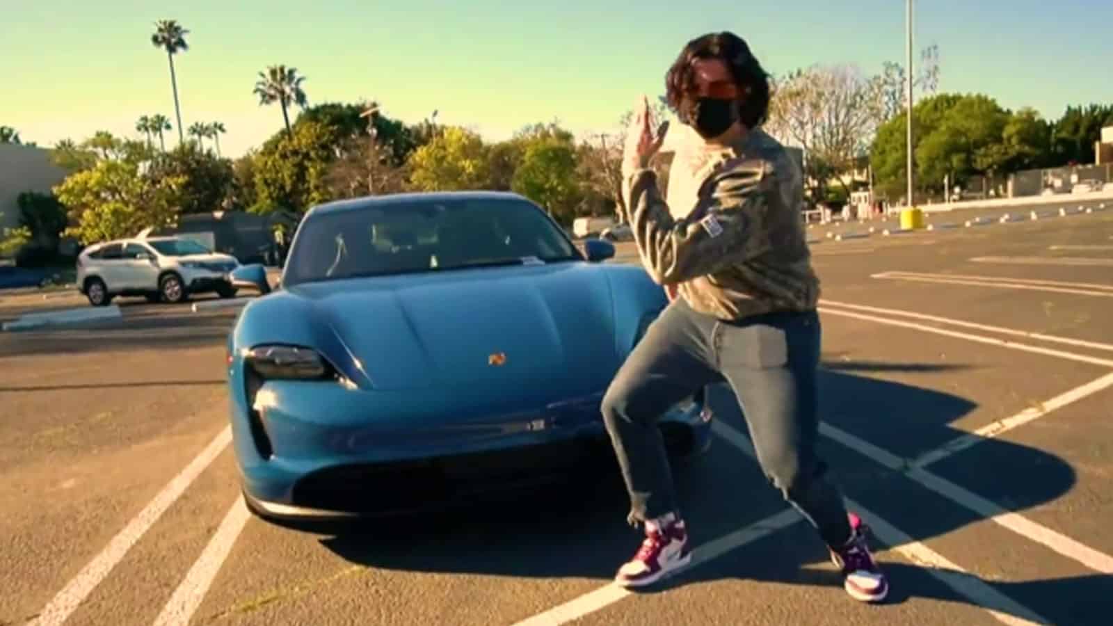 Hasanabi dancing next to his new $200,000 Porsche