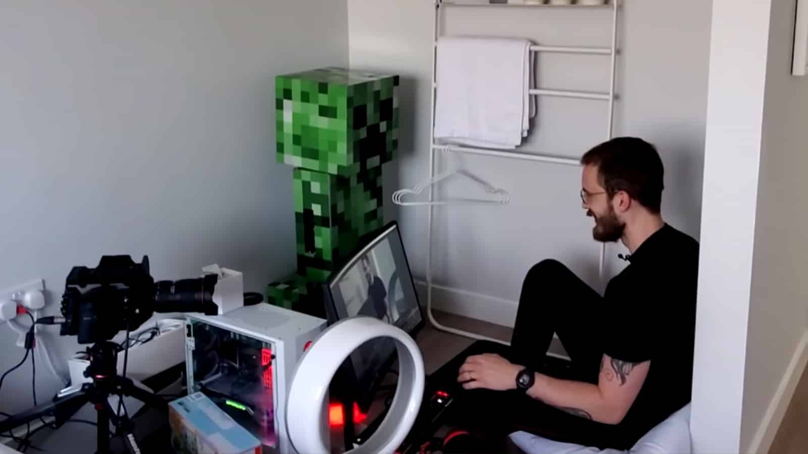 YouTuber PewDiePie sits next to his Minecraft PC screenshot.