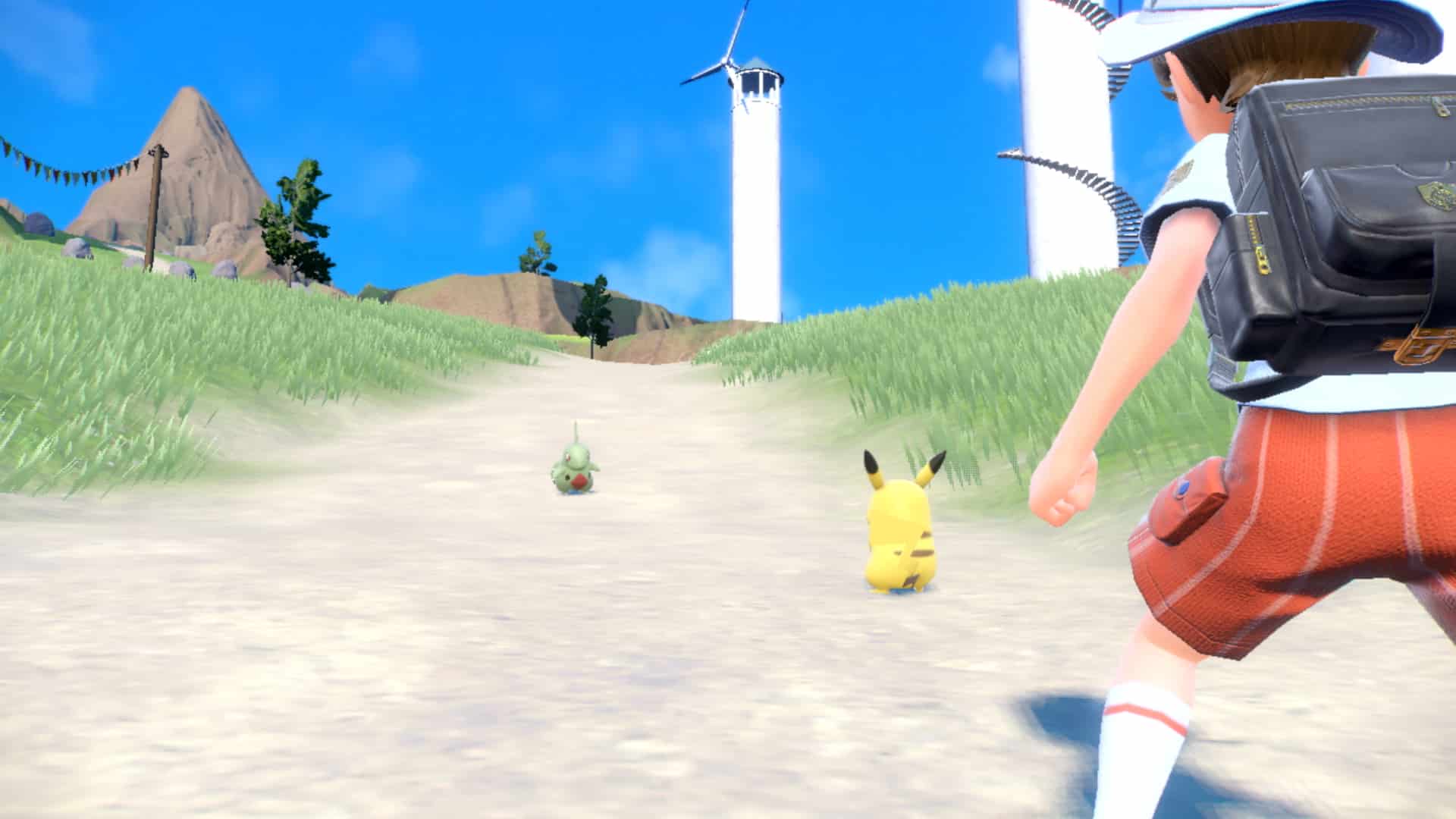 Pokemon Scarlet & Violet Pikachu vs Larvitar battle screenshot.
