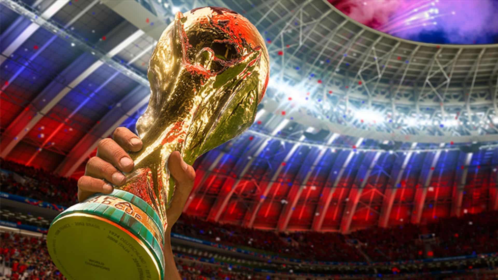 FIFA World Cup trophy being held aloft in FIFA