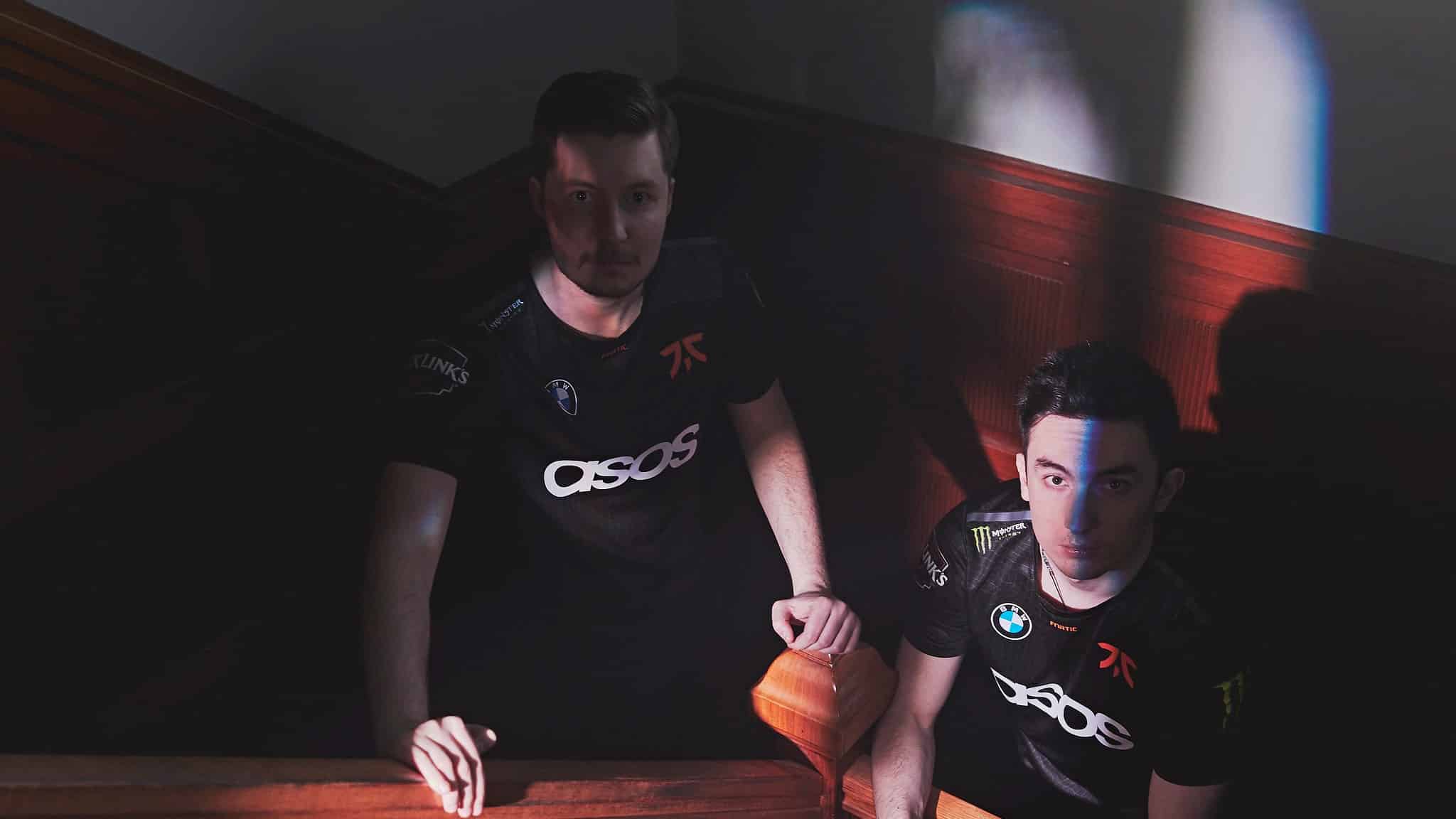 H1ber and Enzo stand and pose on a staircase in Fnatic jerseys. 