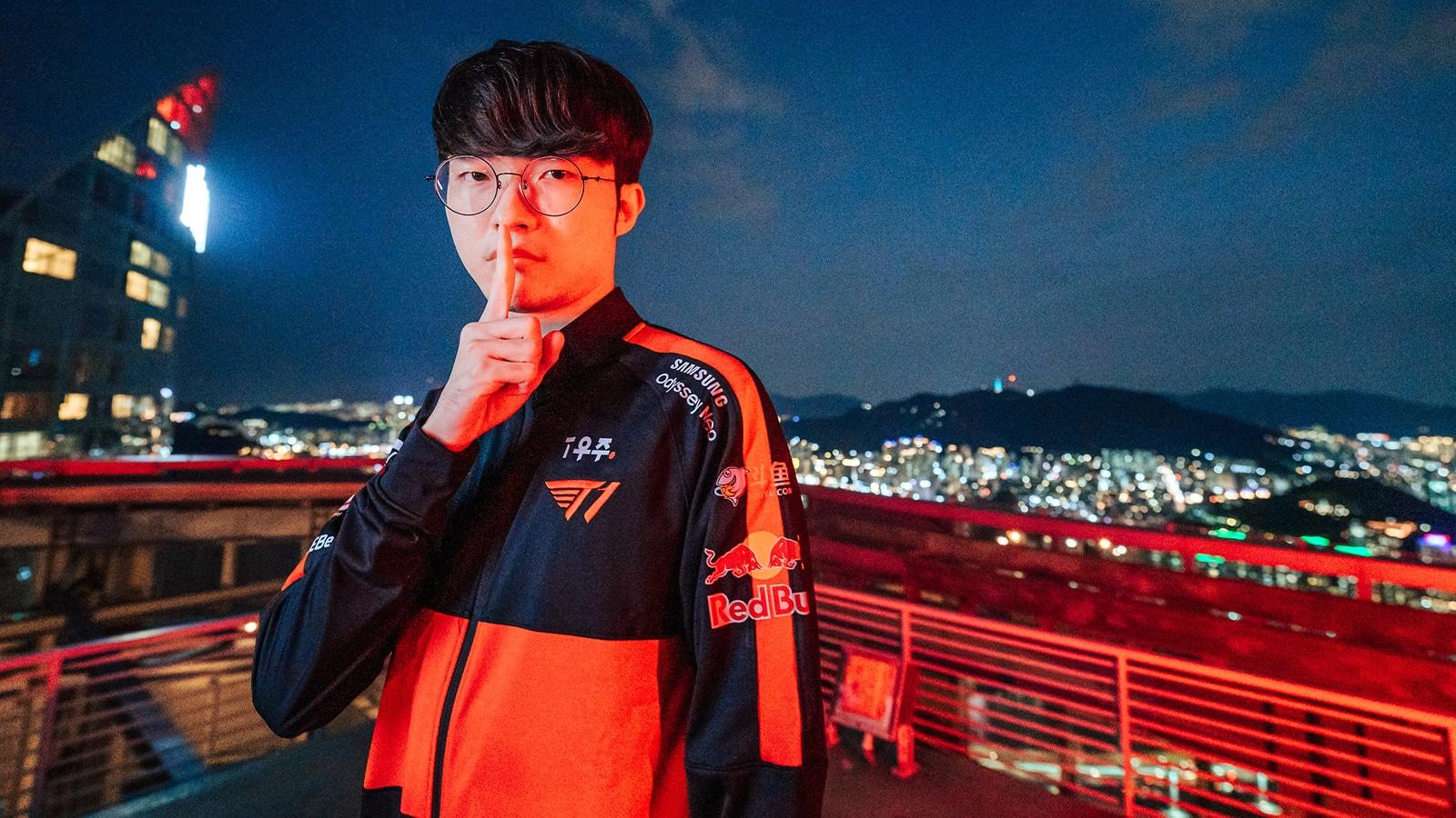Faker holding up hush sign in T1 uniform at MSI 2022