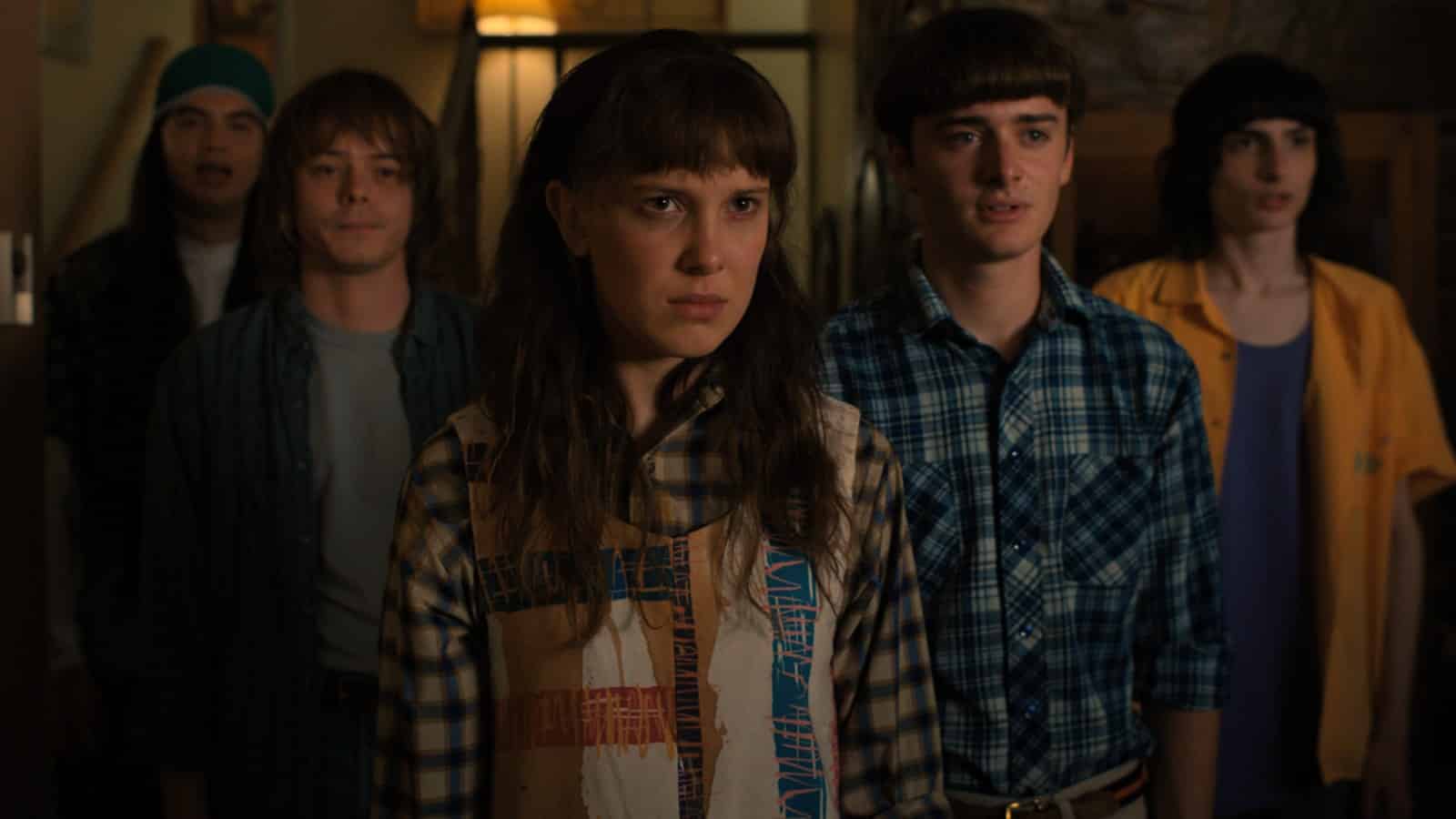 the cast of Stranger things stood looking worried