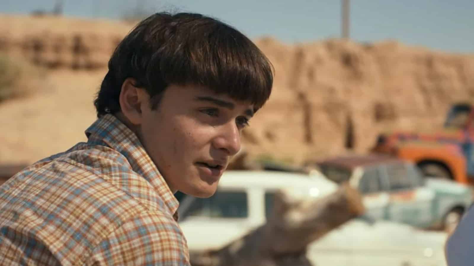will Byers sits in the desert in stranger things