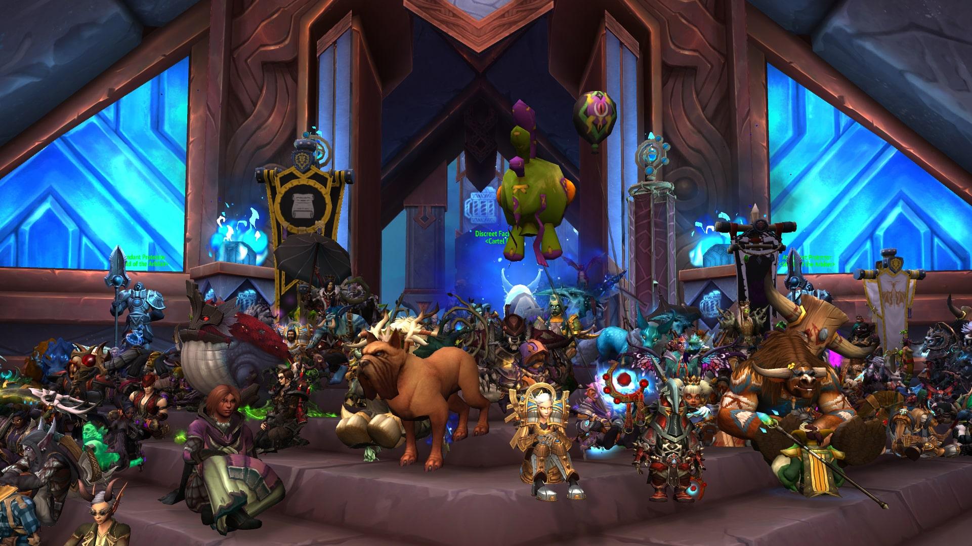 A group of world of warcraft characters sitting on a large set of stairs