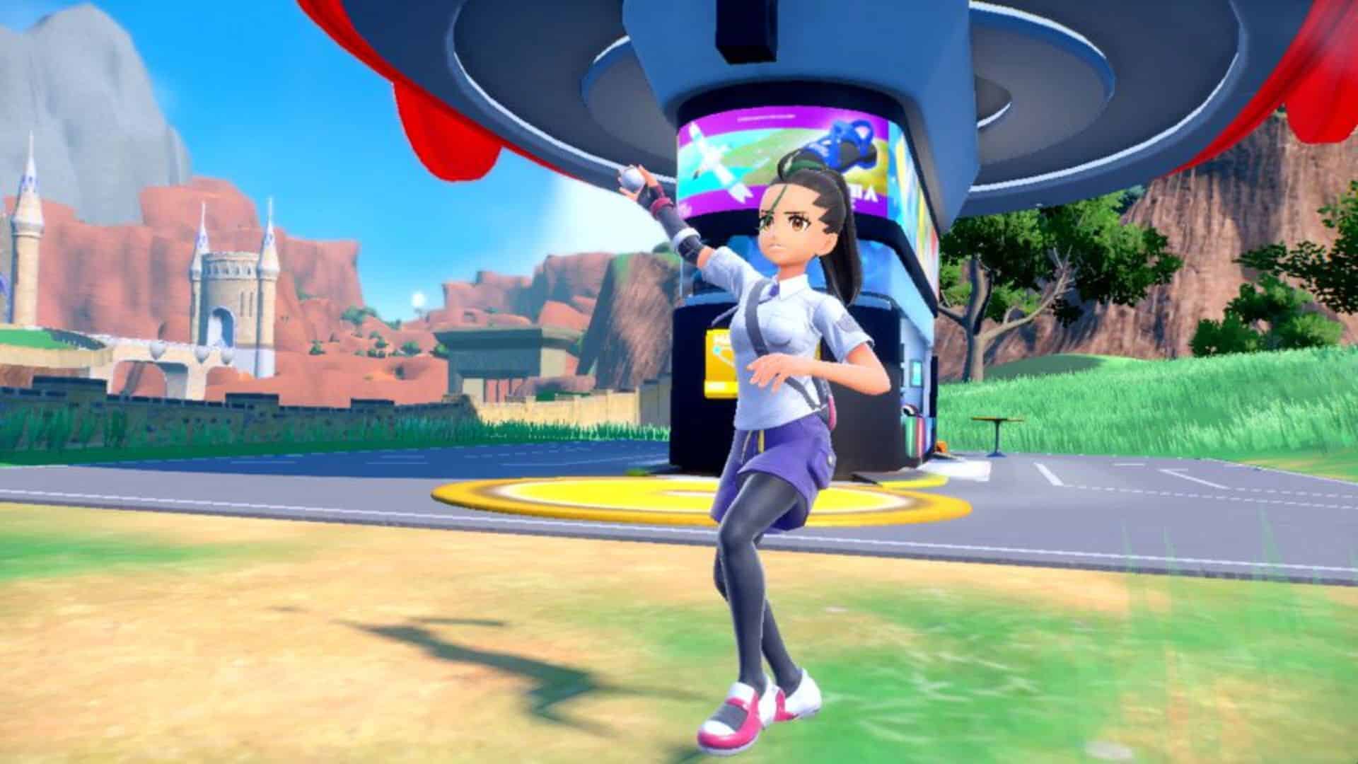 trainer throwing poke ball near poke center in pokemon scarlet and violet