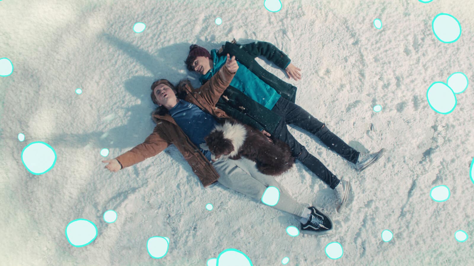 Charlie and Nick lie in the snow on Heartstopper
