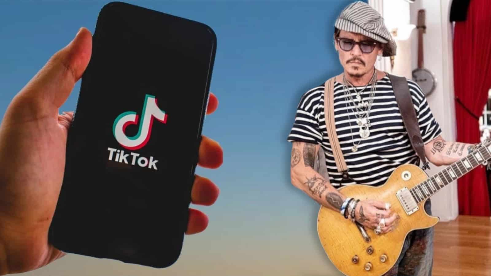 Hand holding a phone displaying the tiktok logo next to an image of johnny depp