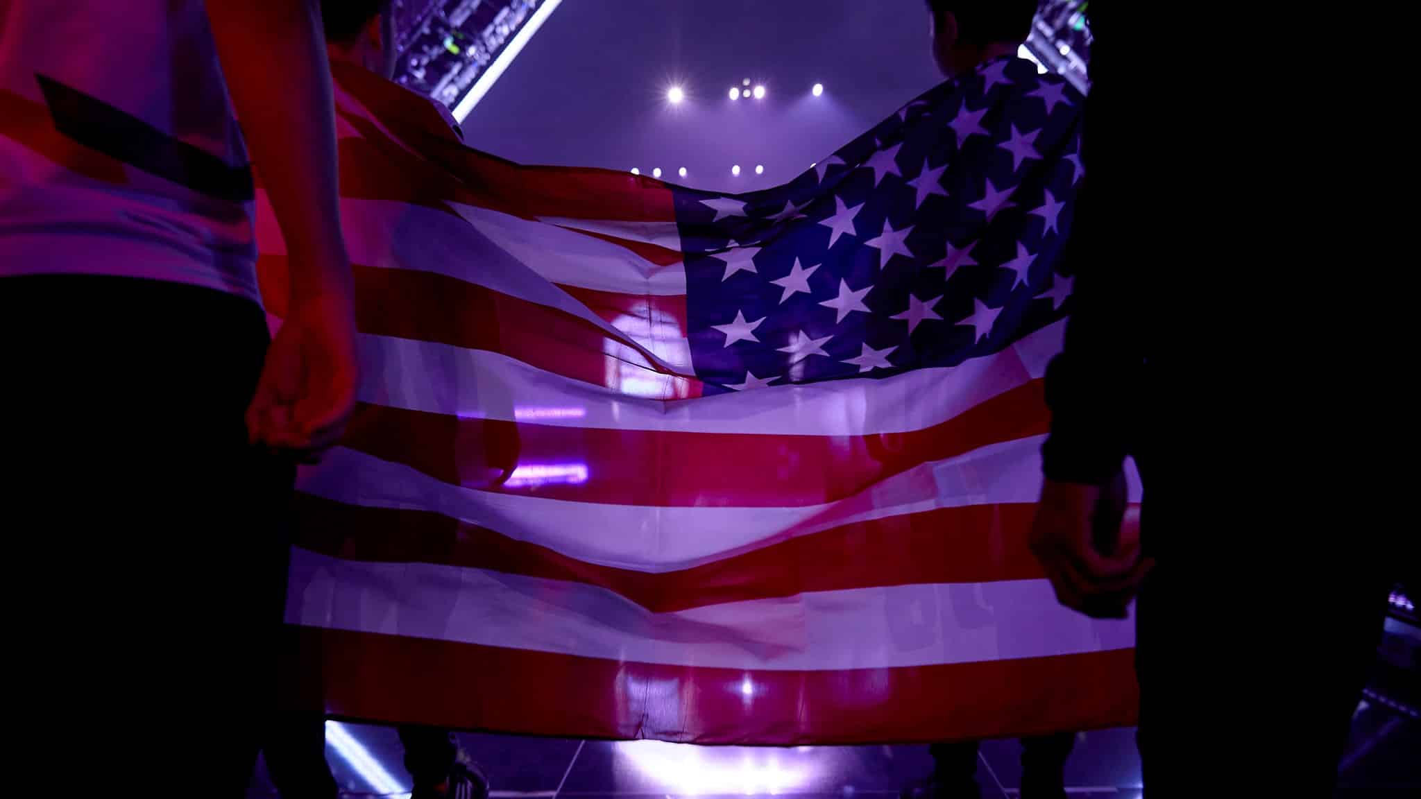 The America flag held between two players before they walk out on stage
