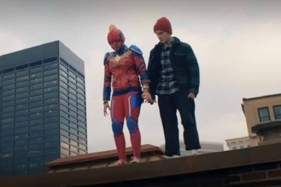 Kamala in her Captain Marvel cosplay, on a roof with Bruno