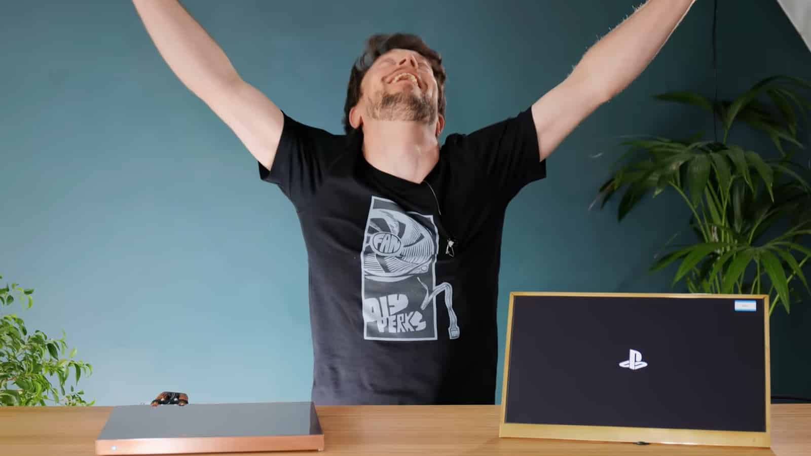 YouTuber DIY Perks celebrates after building a DIY PS5 Slim console