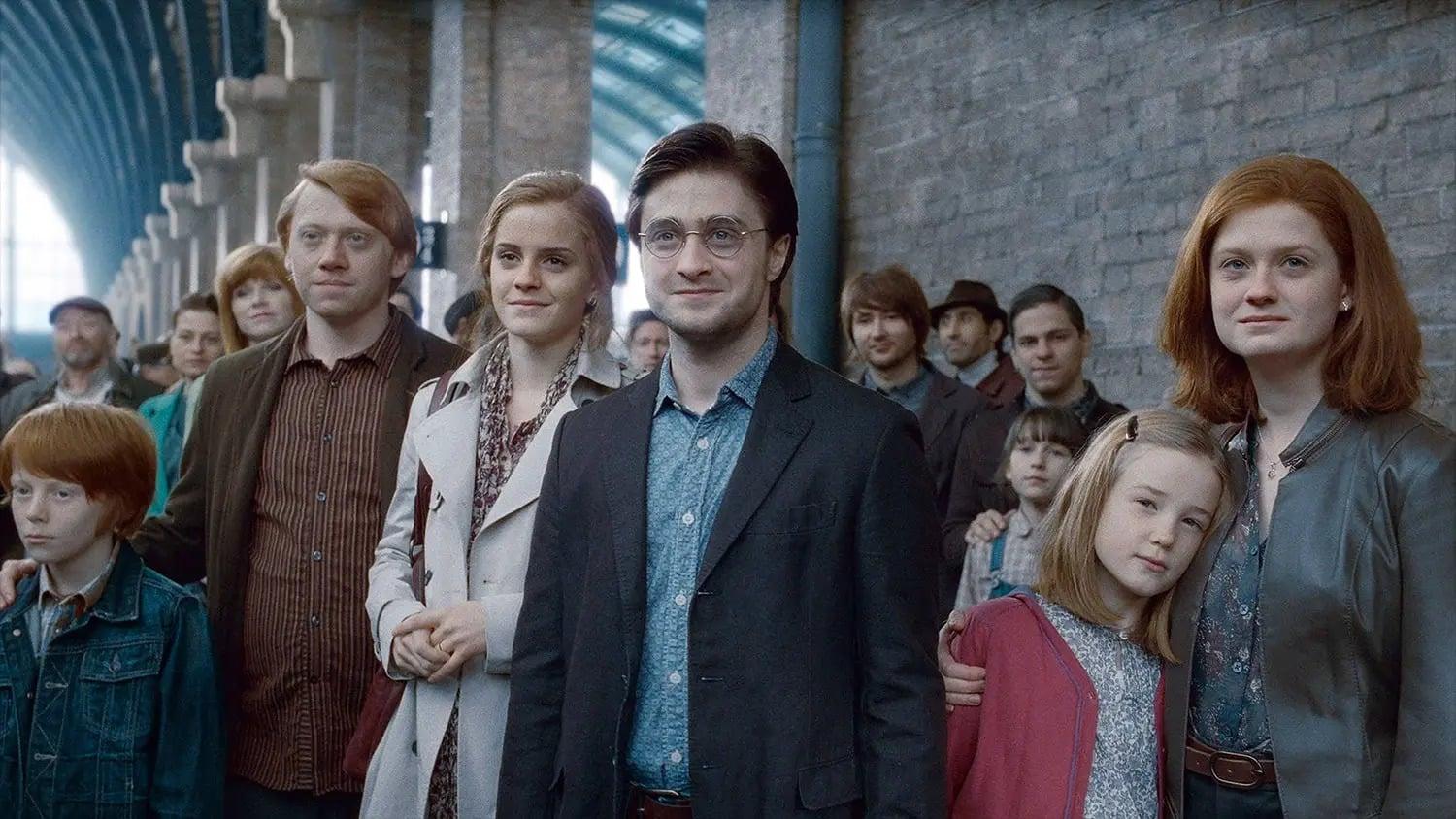 Daniel Radcliffe, Emma Watson, Rupert Grint, and Bonnie Wright at the end of Harry Potter and the Deathly Hallows Part II.