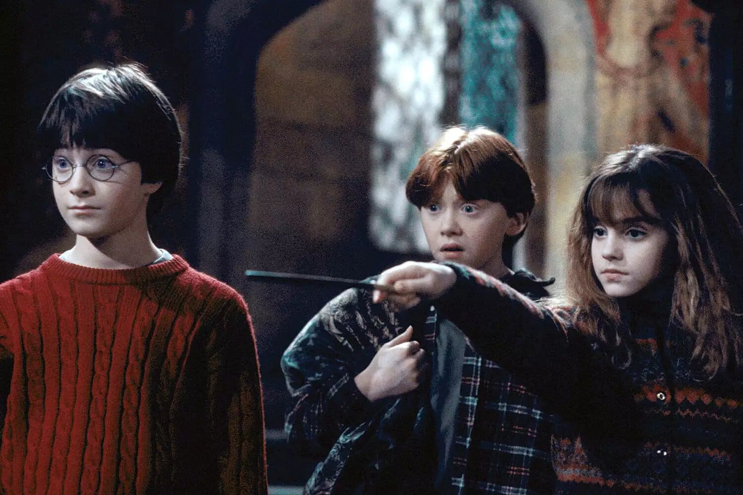 Daniel Radcliffe, Rupert Grint and Emma Watson in Harry Potter and the Philosopher's Stone.