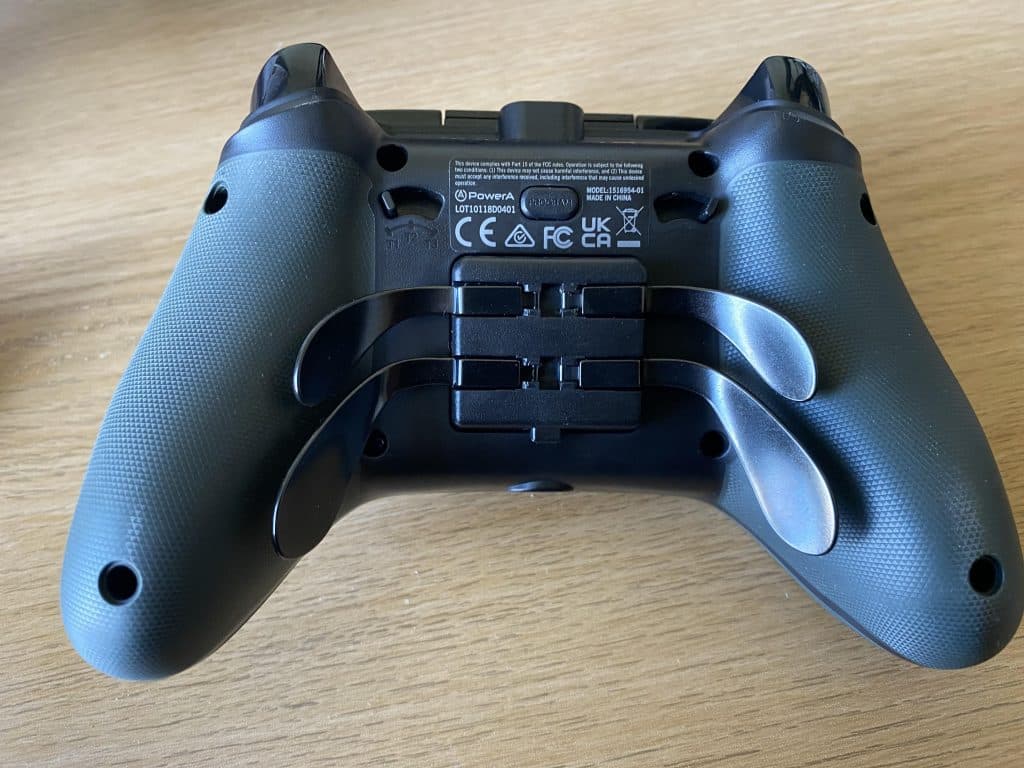 The back of the PowerA Fusion Pro 2 controller, showcasing the paddle attachment and trigger stop functions.