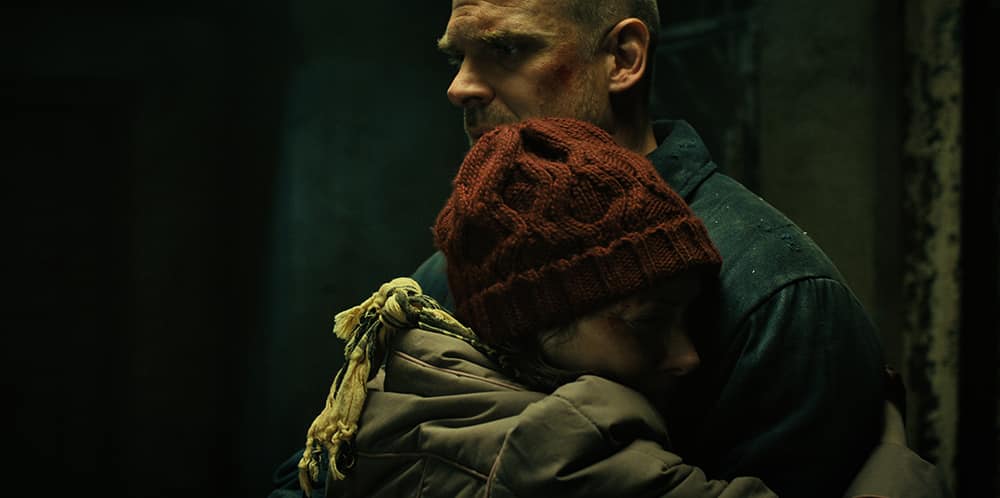 Joyce hugging hopper in Episode 7 of Stranger Things Season 4 on Netflix.