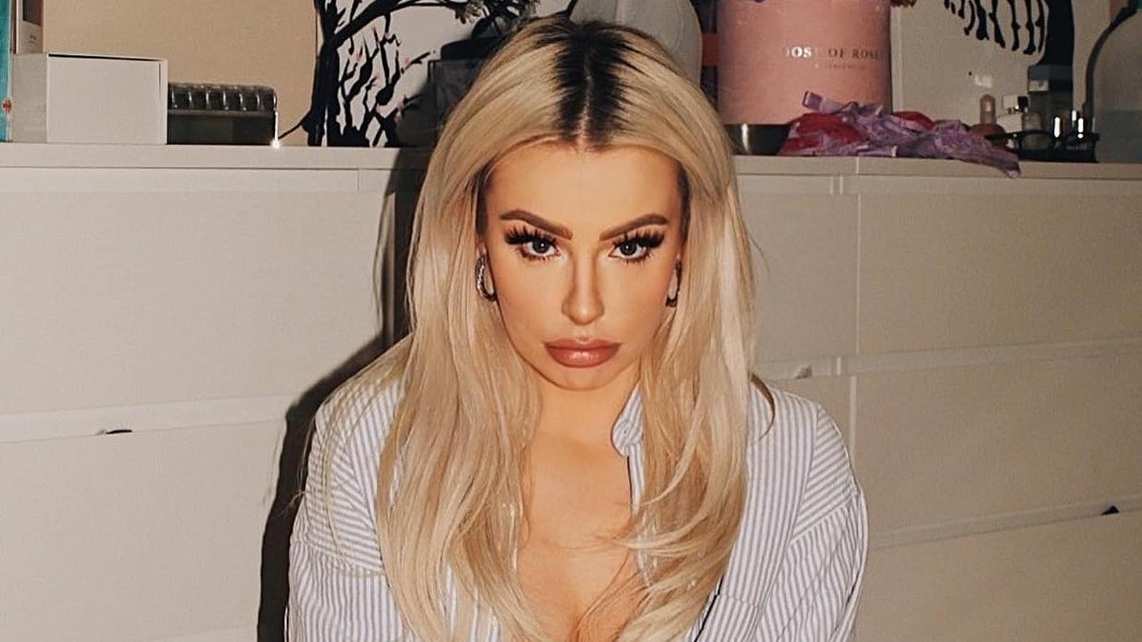 tana mongeau sitting and pouting in instagram photo