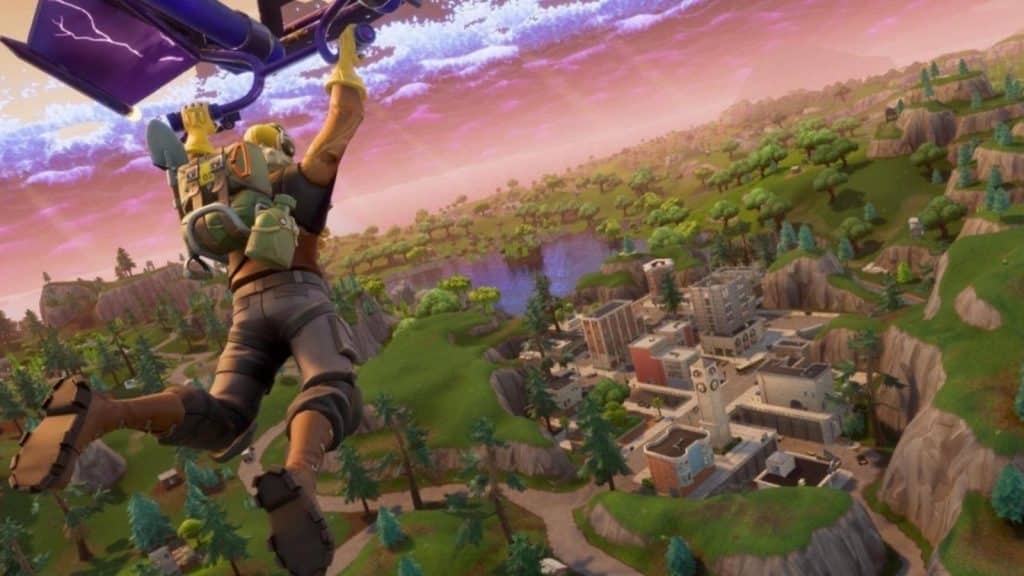 Fortnite character hanging off the plane ready to jump into the battle