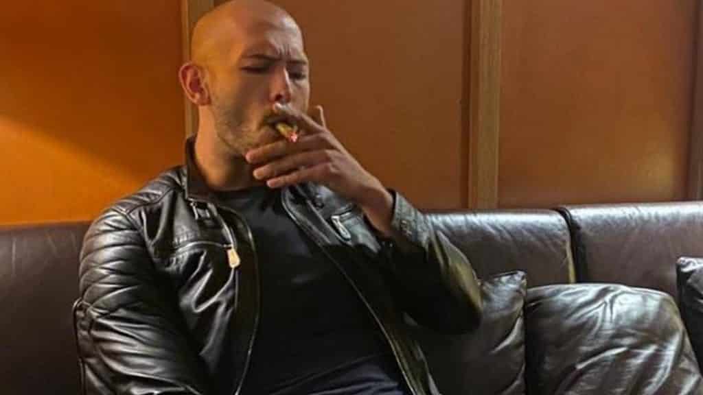 Andrew Tate smoking a cigar