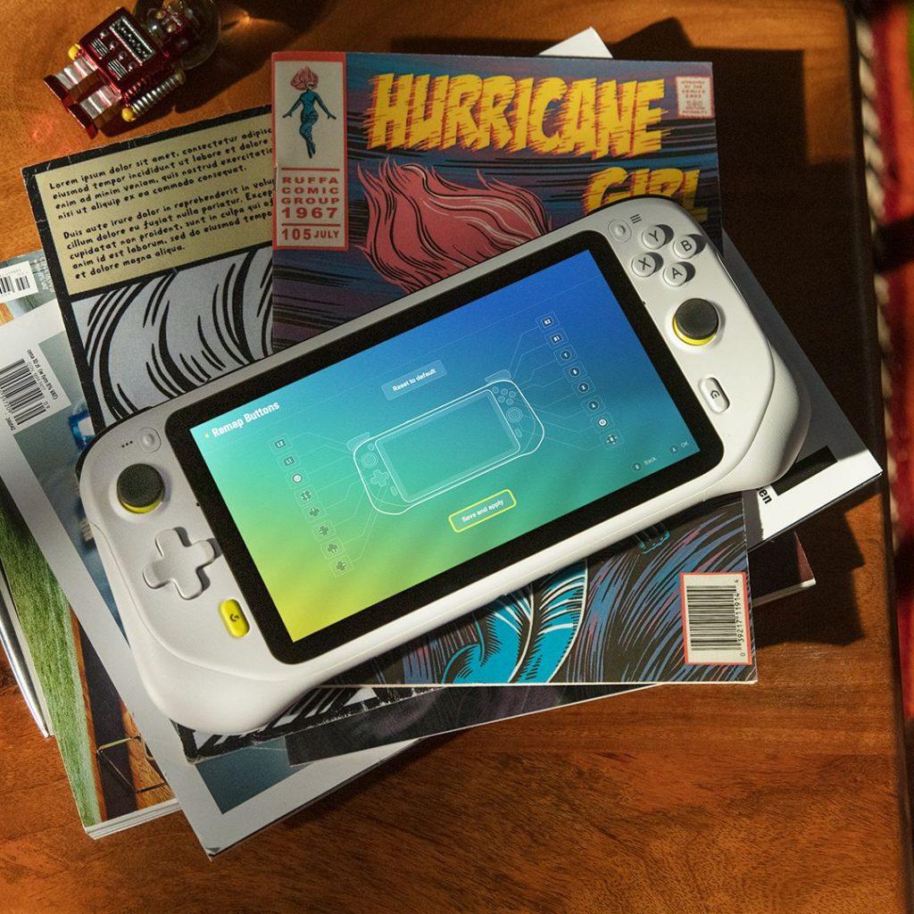 Cloud Gaming Handheld on Stack of Comic Books