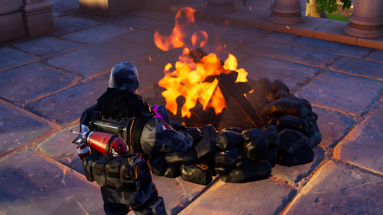 Fortnite campfire location at Restored Reels in Chapter 5 Season 2.