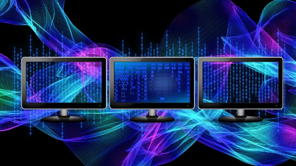 Multiple monitors on a colorful background