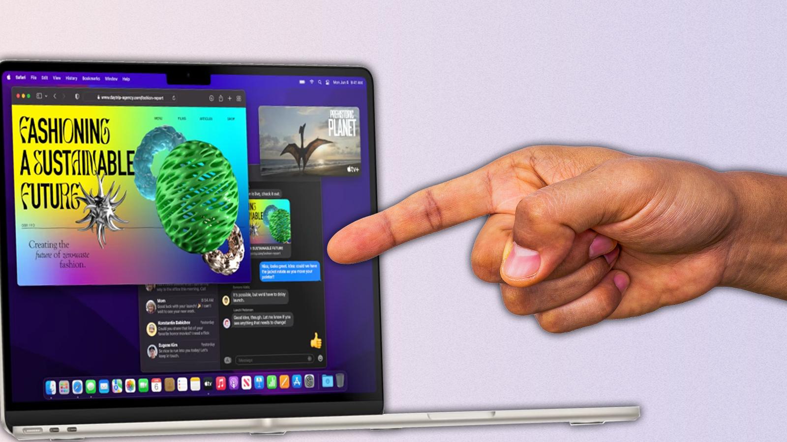 hand touching apple macbook