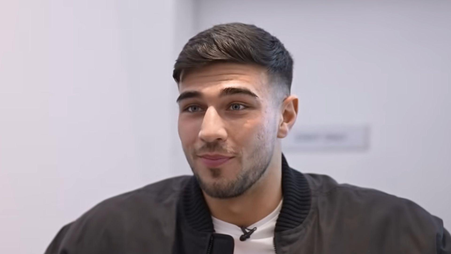 Tommy Fury in black jacket talking to camera