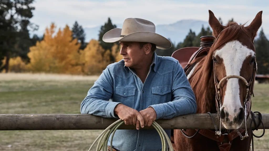 Kevin Costner as John Dutton with a horse in Yellowstone