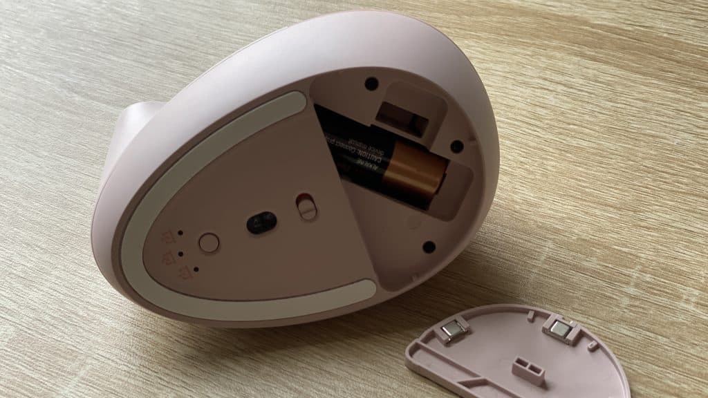 A Logitech Lift Vertical Mouse from the bottom showing where the battery is installed