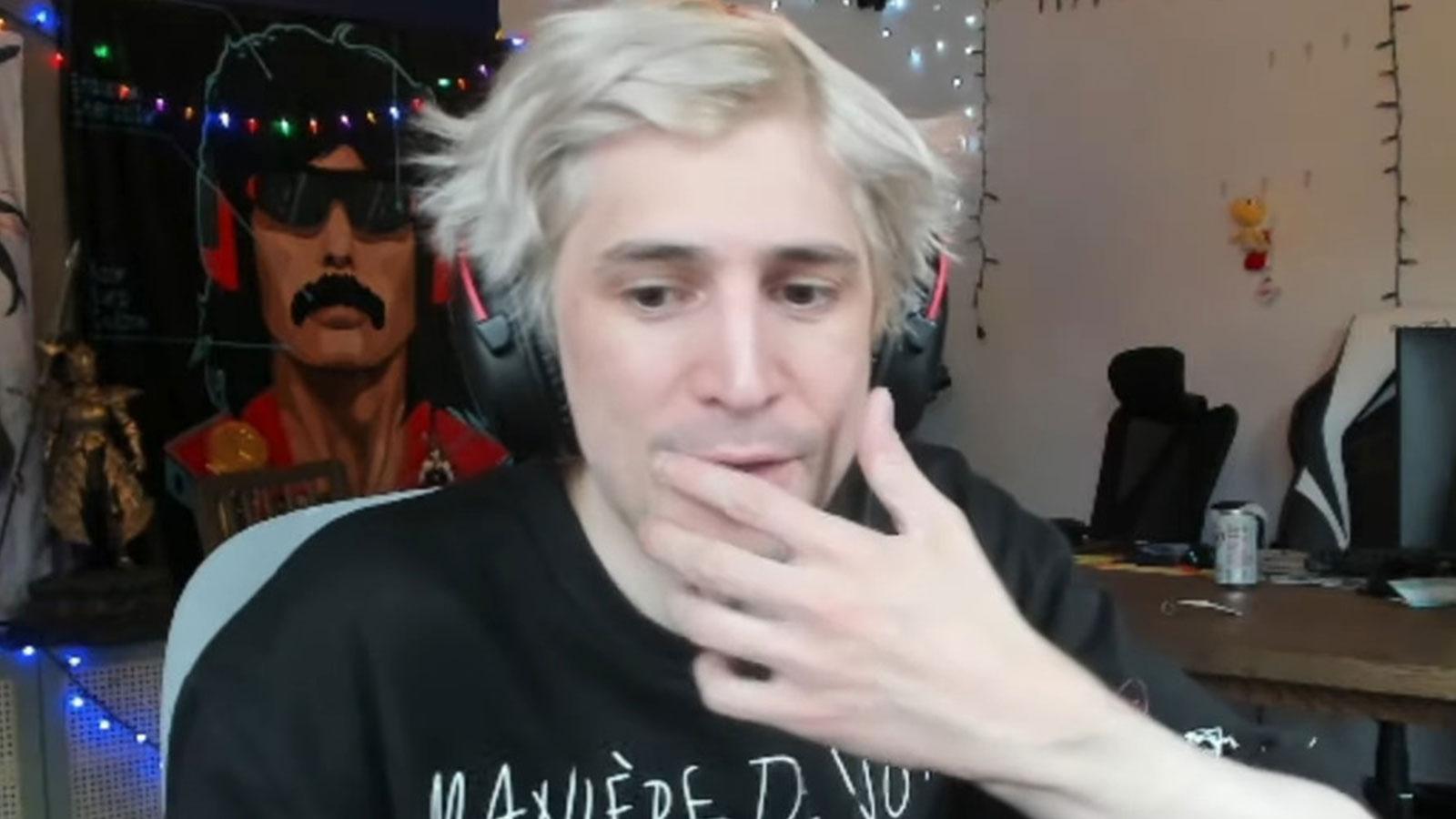xQc holding hand over mouth