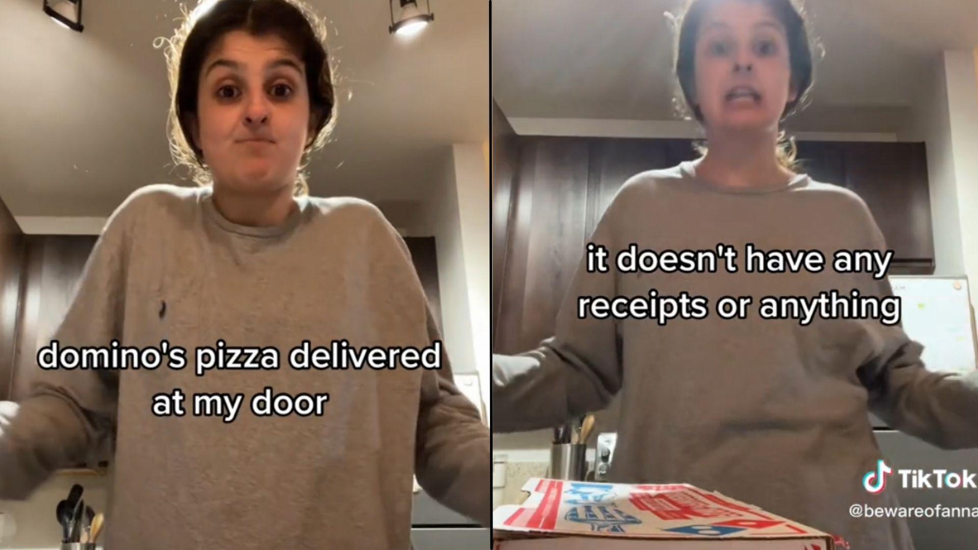 Woman in grey sweater with domino's pizza box and text on screen