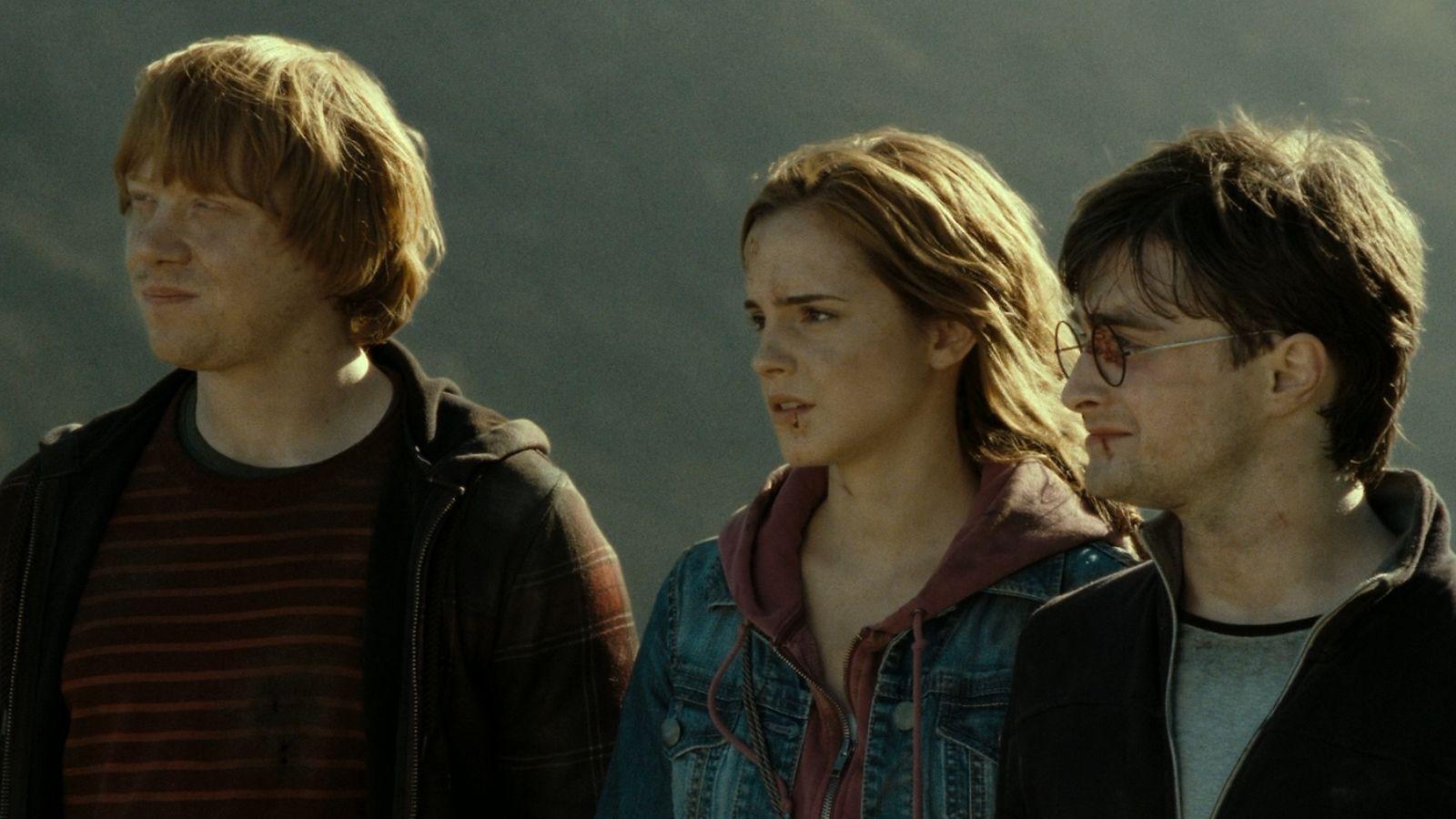 Emma Watson as Hermione Granger, Rupert Grint as Ron Weasley, and Daniel Radcliffe as Harry Potter in Deathly Hallows Part 2.