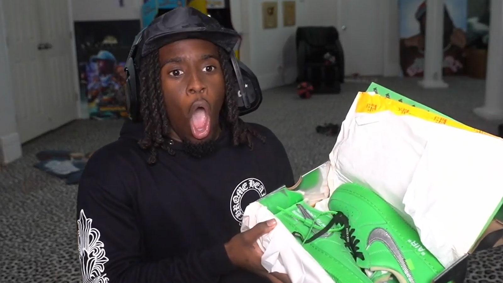 Twitch streamer Kai Cenat holding shoe box containing green Air Force 1s