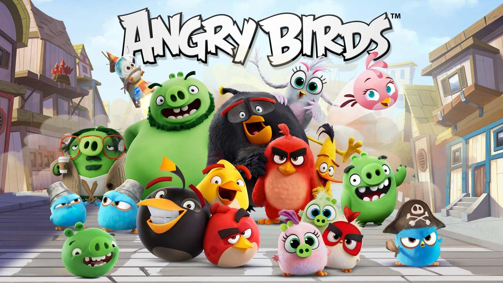 cute Angry Birds posing in front of logo on street