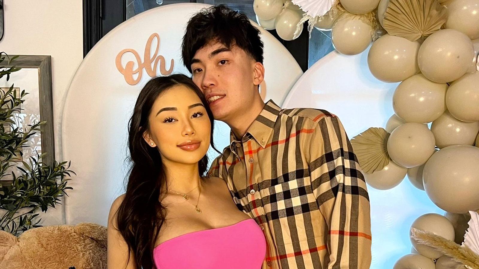 YouTuber Ricegum wearing checkered shirt next to girlfriend wearing pink dress