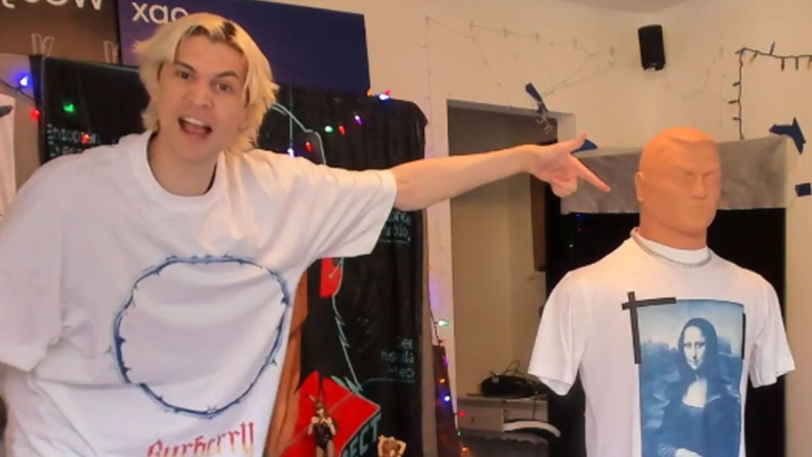 xQc standing and pointing at his freestanding dummy