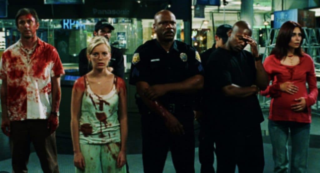 The cast of Dawn of the Dead stands in an empty mall