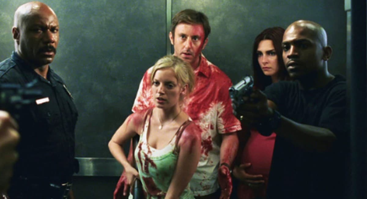 The cast of Dawn of the Dead stand bloodied in an elevator