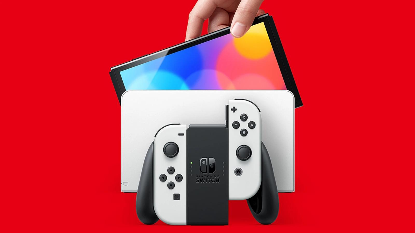 nintendo switch oled model being placed in dock with joycon controller in front.