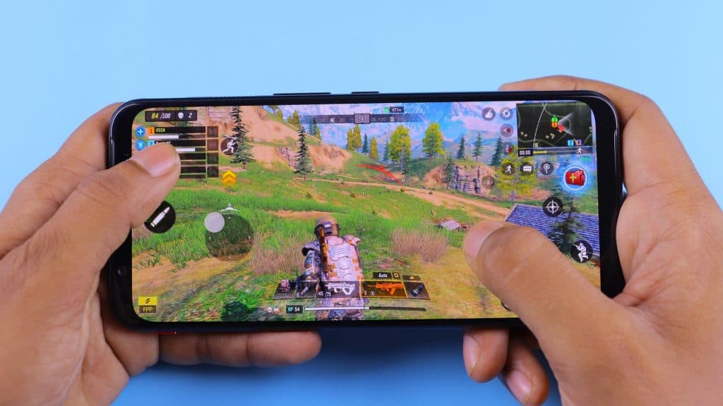 Someone playing games on a mobile phone
