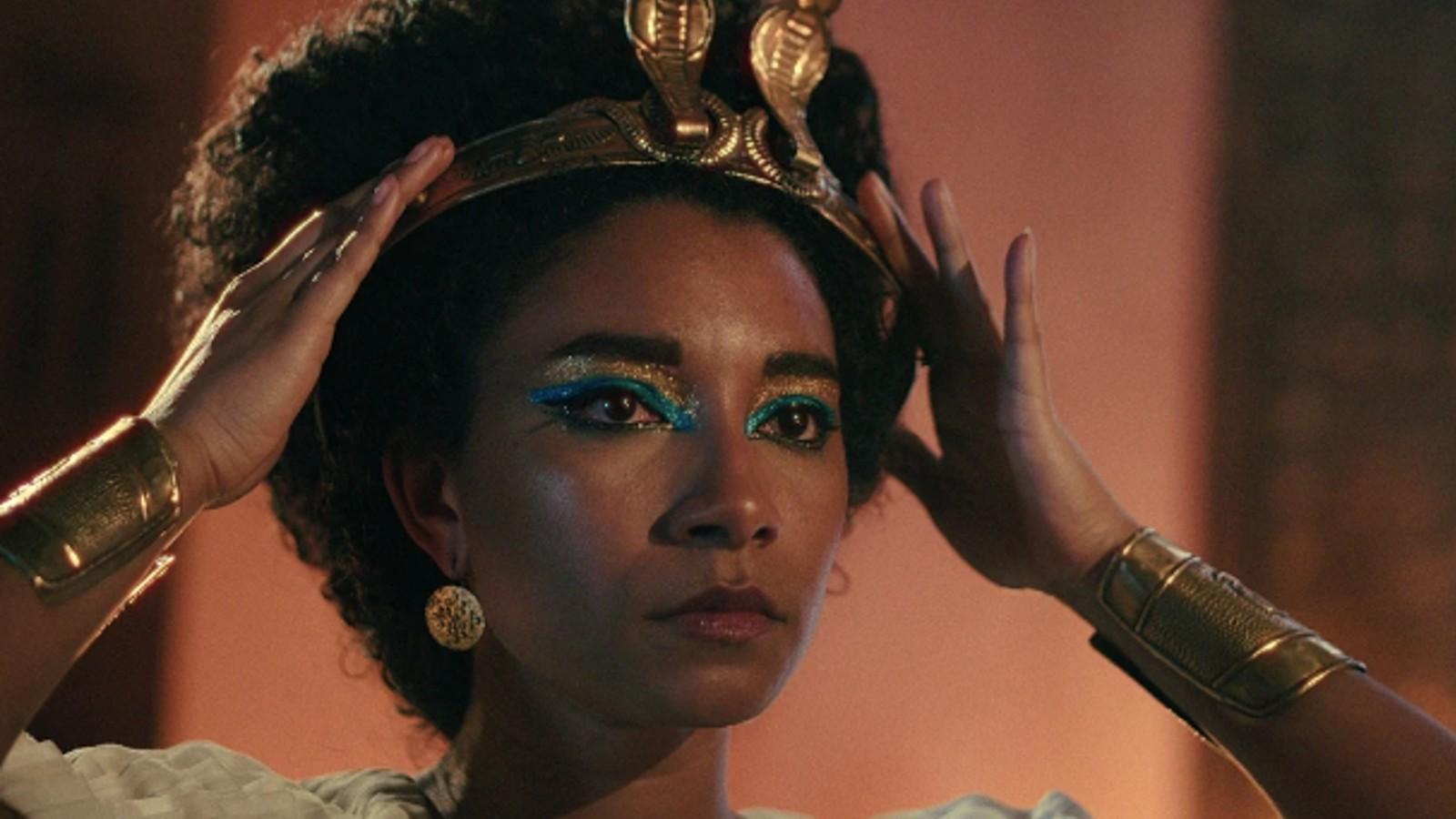 Adele James as Cleopatra wears a crown in Queen Cleopatra